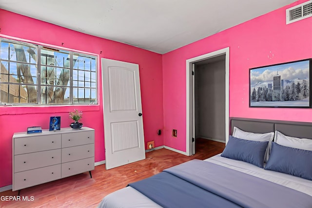 541 Val Verde St, El Paso, TX 79905 - bedroom with wood finished floors and baseboards
