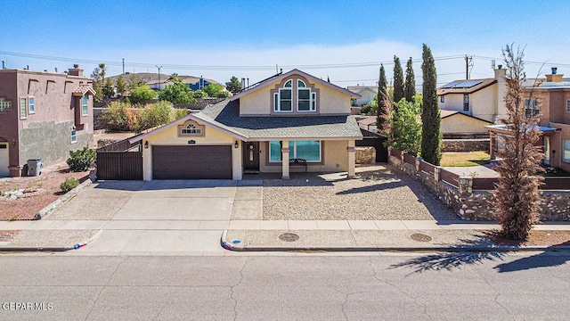 7366 Luz De Dia Ct, El Paso, TX 79912 - view of front of house featuring stucco siding, a garage, concrete driveway, a residential view, and a shingled roof