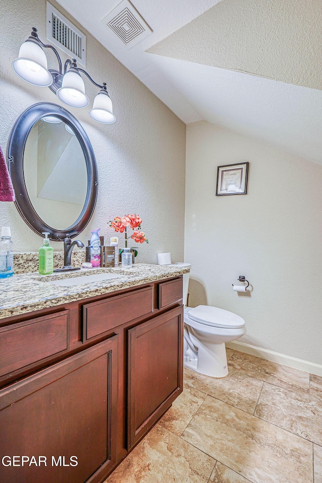 7366 Luz De Dia Ct, El Paso, TX 79912 - bathroom featuring vaulted ceiling, vanity, a textured wall, and a textured ceiling