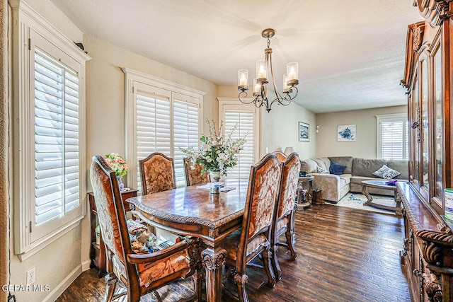 7366 Luz De Dia Ct, El Paso, TX 79912 - dining room with a chandelier and dark wood-style flooring