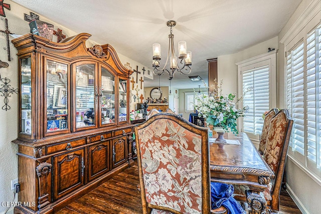 7366 Luz De Dia Ct, El Paso, TX 79912 - dining area with a chandelier, dark wood finished floors, and plenty of natural light