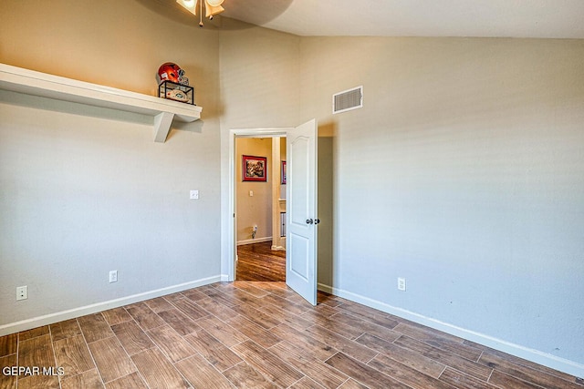7366 Luz De Dia Ct, El Paso, TX 79912 - unfurnished room with wood finish floors, a ceiling fan, and high vaulted ceiling