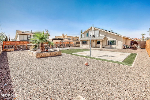 7366 Luz De Dia Ct, El Paso, TX 79912 - back of house featuring a pergola, stucco siding, a fenced backyard, and a patio area