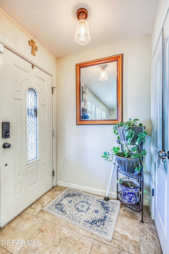 7366 Luz De Dia Ct, El Paso, TX 79912 - entryway with plenty of natural light and a textured ceiling