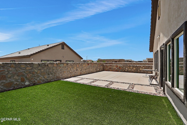 13860 Paseo Sereno Dr, El Paso, TX 79928 - fenced backyard with a patio area