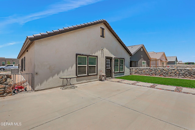 13860 Paseo Sereno Dr, El Paso, TX 79928 - back of house with a patio area and stucco siding