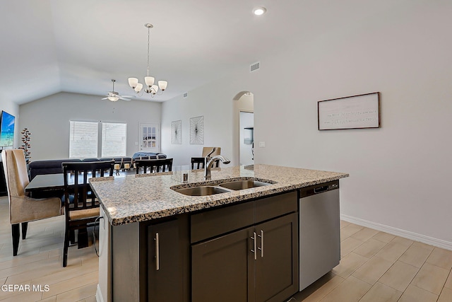 13860 Paseo Sereno Dr, El Paso, TX 79928 - kitchen featuring dishwasher, arched walkways, decorative light fixtures, an island with sink, and light stone countertops