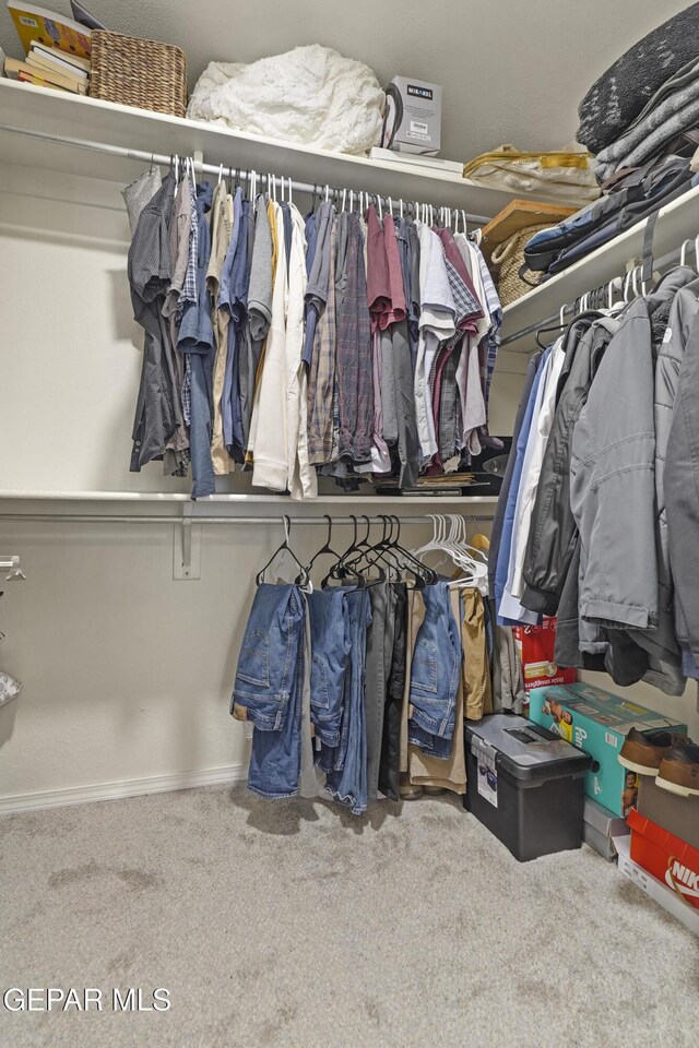 5713 Saplinas Rd, El Paso, TX 79932 - walk in closet with carpet flooring