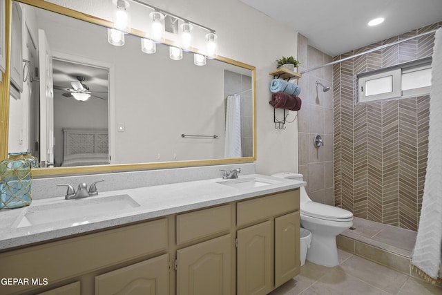 5713 Saplinas Rd, El Paso, TX 79932 - ensuite bathroom with double vanity, tiled shower, tile patterned flooring, and a ceiling fan