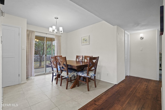 5713 Saplinas Rd, El Paso, TX 79932 - dining space featuring a chandelier and baseboards