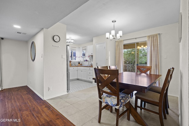 5713 Saplinas Rd, El Paso, TX 79932 - dining room with a chandelier and baseboards
