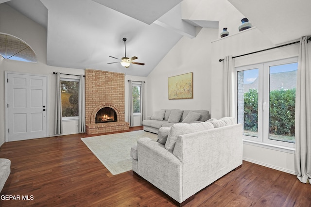 5713 Saplinas Rd, El Paso, TX 79932 - living area with a ceiling fan, dark wood-style floors, beamed ceiling, high vaulted ceiling, and a fireplace