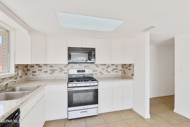 241 Mardi Gras Dr, El Paso, TX 79912 - kitchen featuring stainless steel range with gas cooktop, black dishwasher, backsplash, and white cabinets