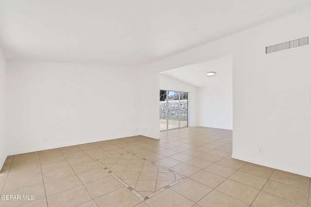 241 Mardi Gras Dr, El Paso, TX 79912 - spare room featuring lofted ceiling and light tile patterned floors