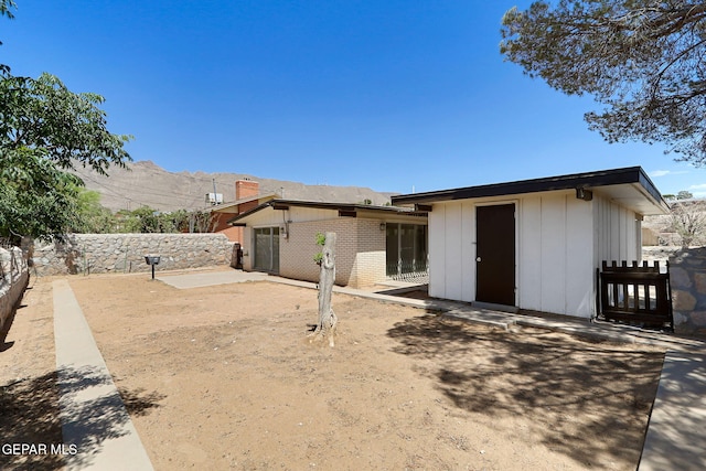 241 Mardi Gras Dr, El Paso, TX 79912 - rear view of house with a patio, a fenced backyard, and brick siding