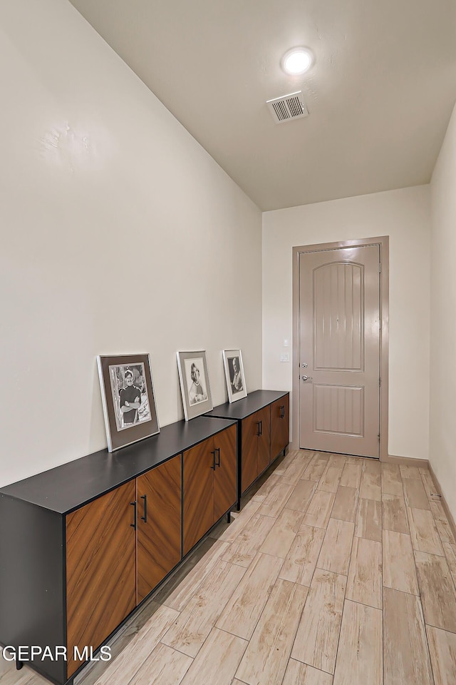 7825 Enchanted View Dr, El Paso, TX 79911 - hallway with light wood-style flooring and baseboards