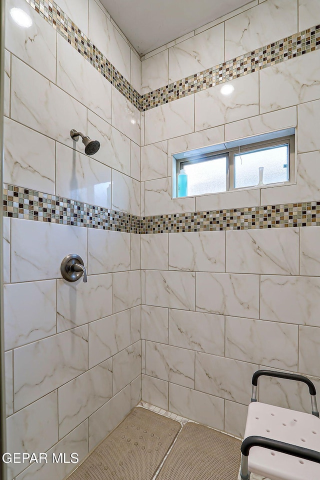 7825 Enchanted View Dr, El Paso, TX 79911 - full bathroom with tiled shower and plenty of natural light