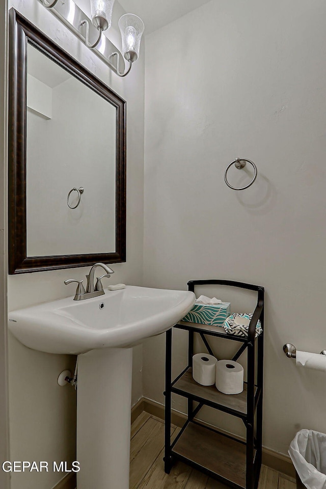 7825 Enchanted View Dr, El Paso, TX 79911 - bathroom with wood finished floors and a chandelier