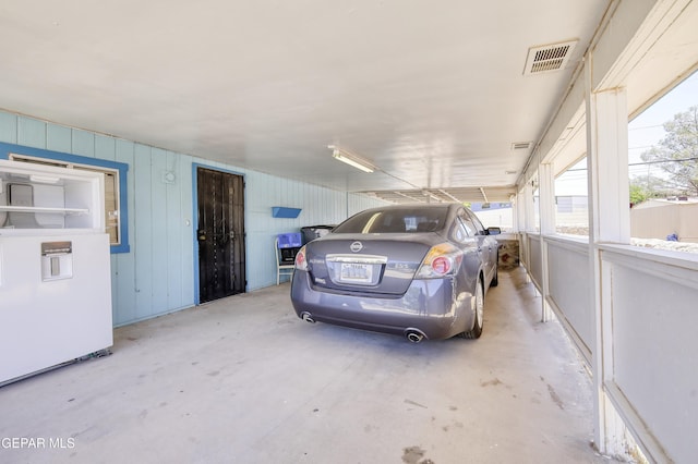 1268 Stanley St, El Paso, TX 79907 - garage featuring a carport