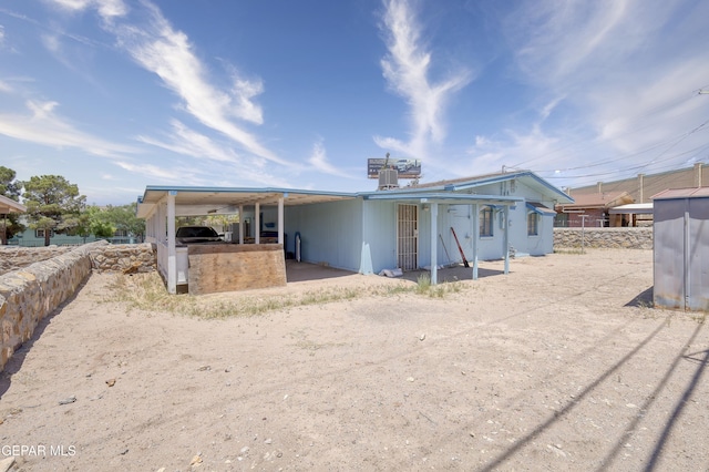 1268 Stanley St, El Paso, TX 79907 - back of property with a carport