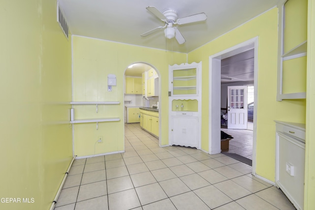 1268 Stanley St, El Paso, TX 79907 - spare room with ceiling fan, light tile patterned floors, and arched walkways