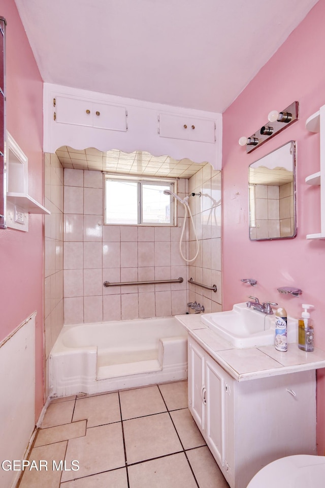 1268 Stanley St, El Paso, TX 79907 - full bathroom featuring tile patterned flooring, vanity, and washtub / shower combination