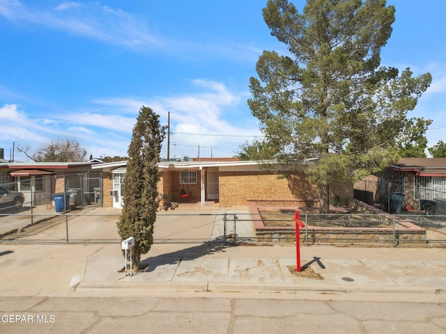 8763 Cathedral Cir, El Paso, TX 79907 - single story home with brick siding and a fenced front yard