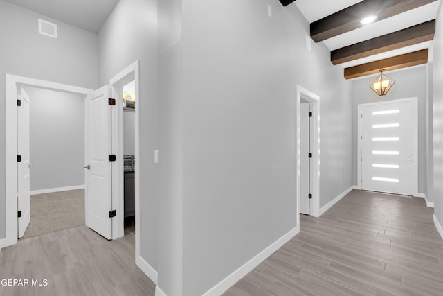 13829 Summer View Ave, Horizon City, TX 79928 - hallway featuring light wood-type flooring and beam ceiling