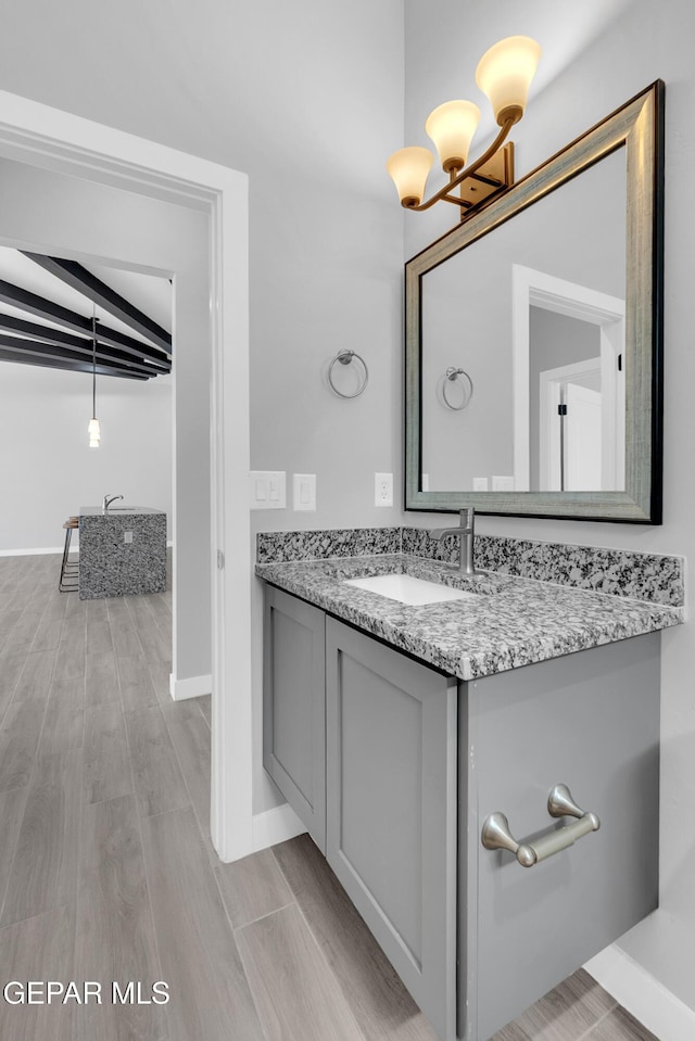 13829 Summer View Ave, Horizon City, TX 79928 - bathroom featuring vanity, a chandelier, and wood finished floors