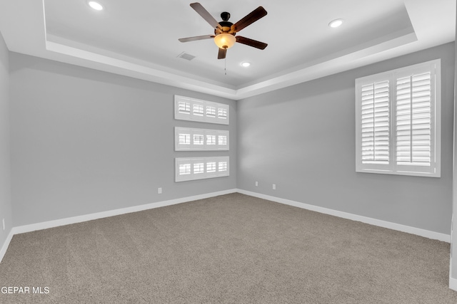 13829 Summer View Ave, Horizon City, TX 79928 - carpeted empty room with a tray ceiling, a ceiling fan, and recessed lighting
