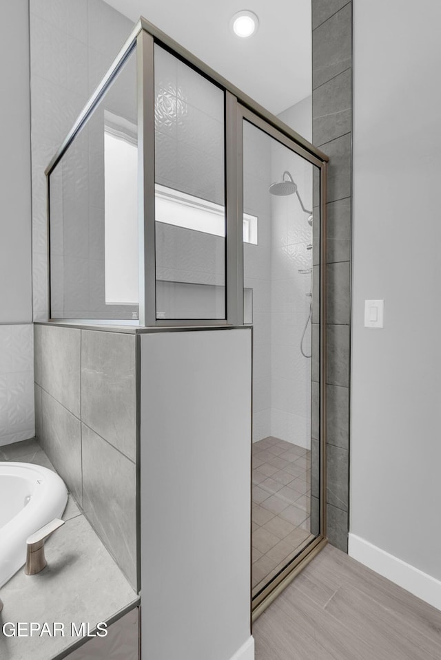 13829 Summer View Ave, Horizon City, TX 79928 - full bathroom featuring a shower stall and a tub to relax in