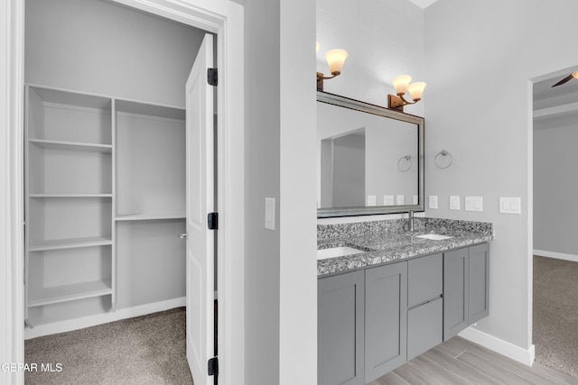 13829 Summer View Ave, Horizon City, TX 79928 - bathroom featuring double vanity and baseboards