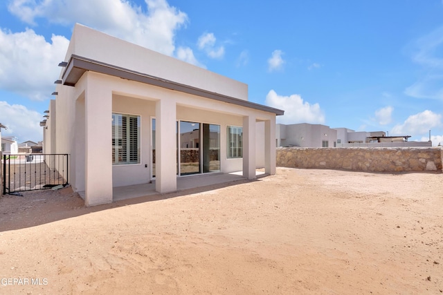13829 Summer View Ave, Horizon City, TX 79928 - back of house with stucco siding and a patio