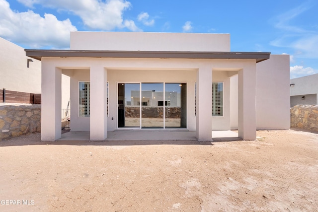 13829 Summer View Ave, Horizon City, TX 79928 - back of property featuring stucco siding and a patio