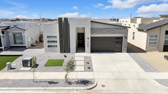 13829 Summer View Ave, Horizon City, TX 79928 - view of front of home featuring an attached garage, driveway, and stucco siding