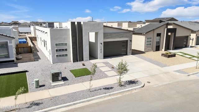 13829 Summer View Ave, Horizon City, TX 79928 - contemporary house featuring stucco siding, concrete driveway, an attached garage, and a residential view