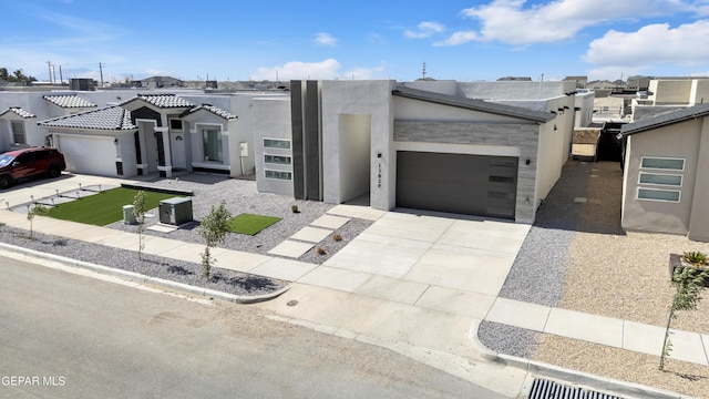 13829 Summer View Ave, Horizon City, TX 79928 - view of front facade with concrete driveway, a garage, stucco siding, and a residential view