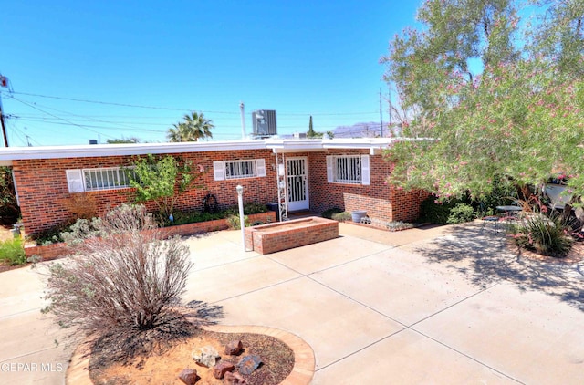 5108 Paris Ave, El Paso, TX 79924 - view of front of house featuring brick siding and a patio