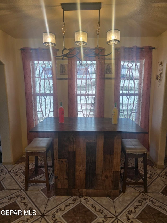 14185 Silver Point Ave, El Paso, TX 79938 - dining room featuring light tile patterned floors