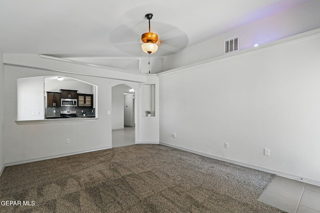 12469 Lanchester Dr, El Paso, TX 79928 - unfurnished room with ceiling fan, arched walkways, and carpet flooring