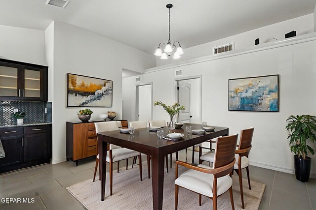 12469 Lanchester Dr, El Paso, TX 79928 - dining space featuring light tile patterned flooring and a chandelier