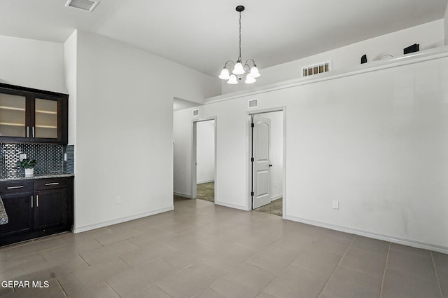 12469 Lanchester Dr, El Paso, TX 79928 - unfurnished dining area with a chandelier and baseboards