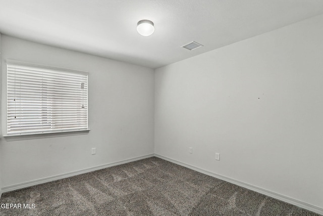 12469 Lanchester Dr, El Paso, TX 79928 - empty room featuring dark carpet and baseboards