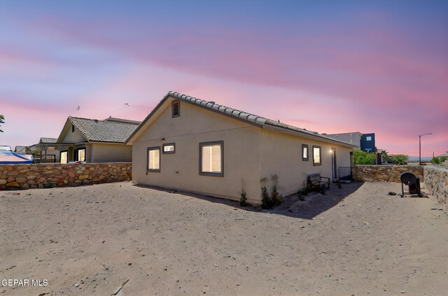 12469 Lanchester Dr, El Paso, TX 79928 - property exterior at dusk featuring stucco siding