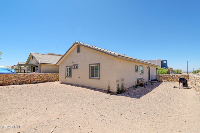 12469 Lanchester Dr, El Paso, TX 79928 - rear view of property with stucco siding