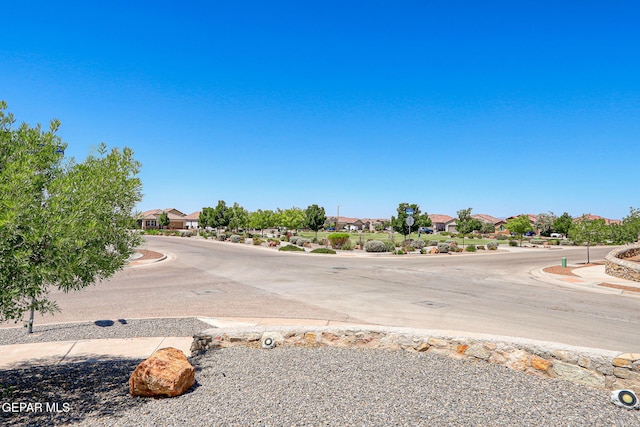 12469 Lanchester Dr, El Paso, TX 79928 - view of asphalt street featuring a residential view and curbs