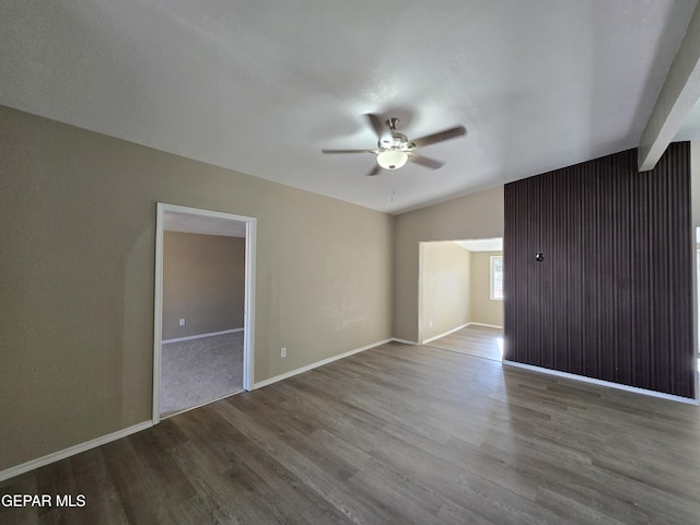 1607 Gene Torres Dr, El Paso, TX 79936 - unfurnished bedroom featuring wood finished floors, vaulted ceiling, and ceiling fan