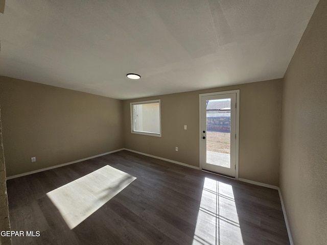 1607 Gene Torres Dr, El Paso, TX 79936 - spare room featuring dark wood-style flooring