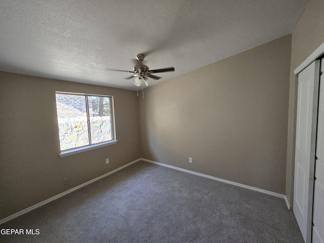 1607 Gene Torres Dr, El Paso, TX 79936 - unfurnished bedroom with carpet, a textured ceiling, a ceiling fan, and a closet