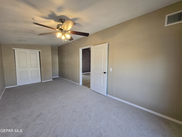 1607 Gene Torres Dr, El Paso, TX 79936 - unfurnished bedroom featuring carpet, a closet, and ceiling fan